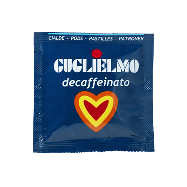 Eine blaue Aromaverpackung für den koffeinfreien Kaffee Guglielmo Dek als E.S.E. Pad. In der Mitte befindet sich ein Herz in den Farben orange, gelb und rot.