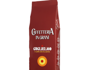 Eine braune Aromaverpackung für den Kaffee Guglielmo Caffetteria in Bohnen. Oben ist der große weiße Schriftzug Caffetteria in grani zu lesen, darunter Guglielmo il caffè che fa centro. Unten sieht man das Logo mit dem orange, gelb, roten konzentrischen Kreis.